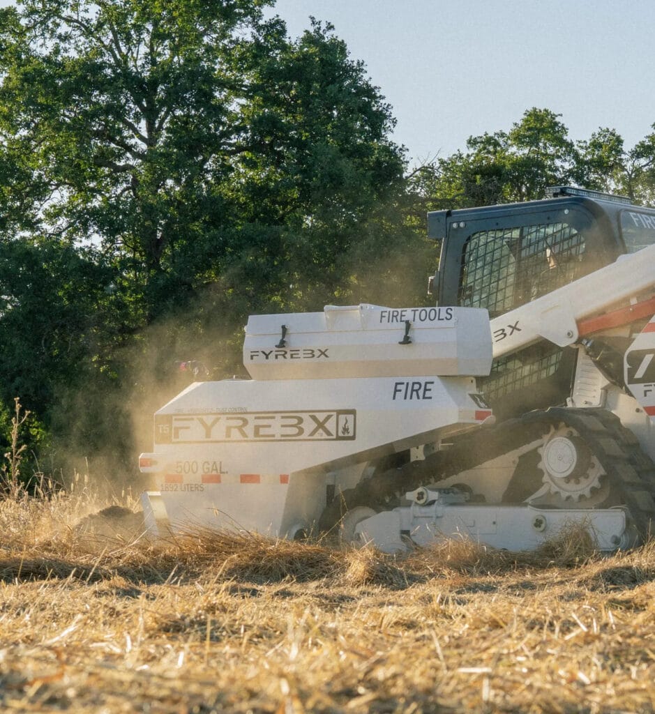 Gray FYREBX skid steer implement.